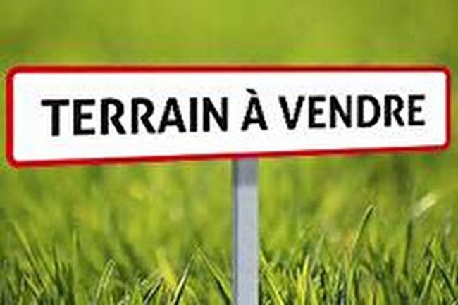 Terrain plat à proximité immédiate des commerces